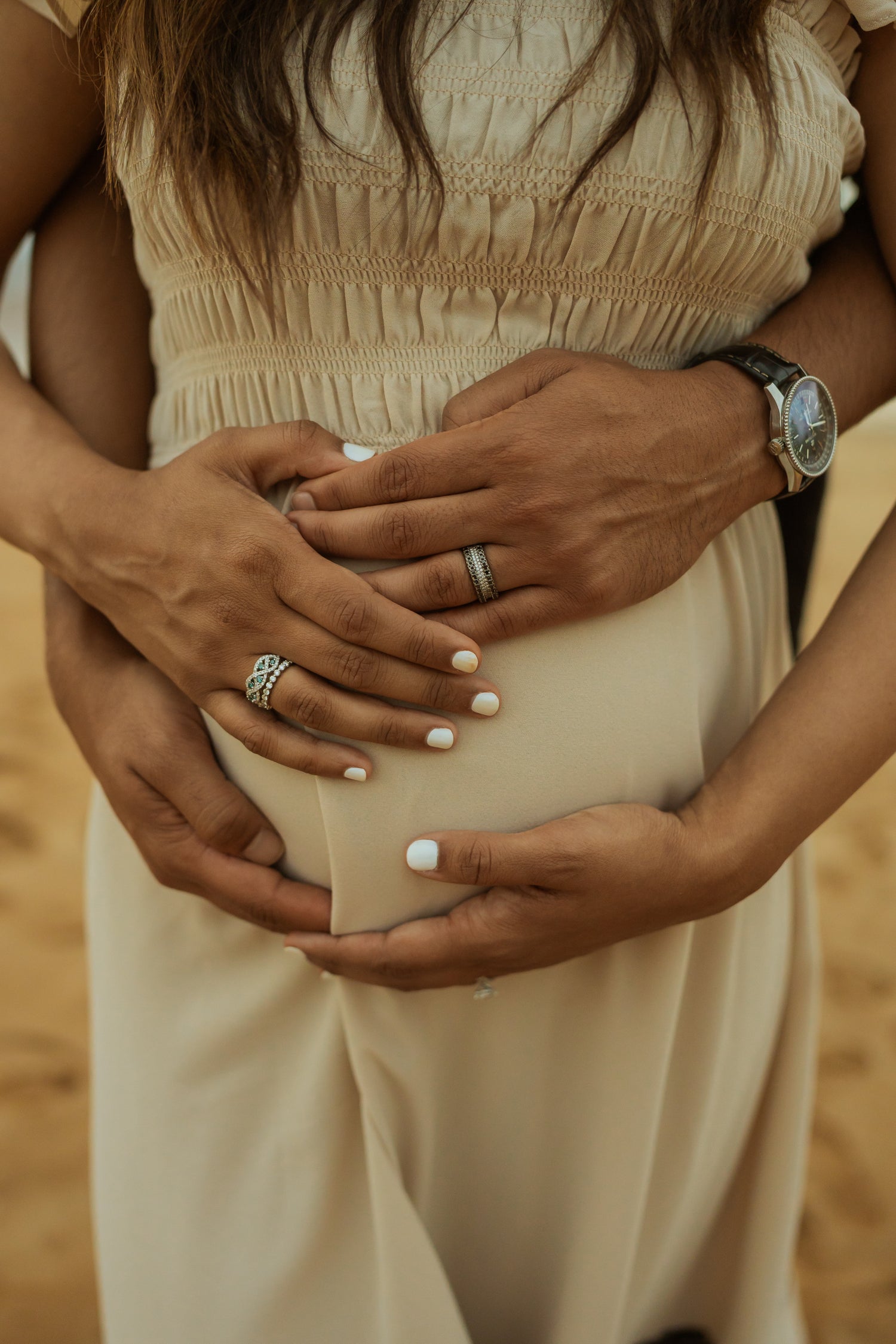 Fifth Alloy rings worn during an outdoor maternity portrait