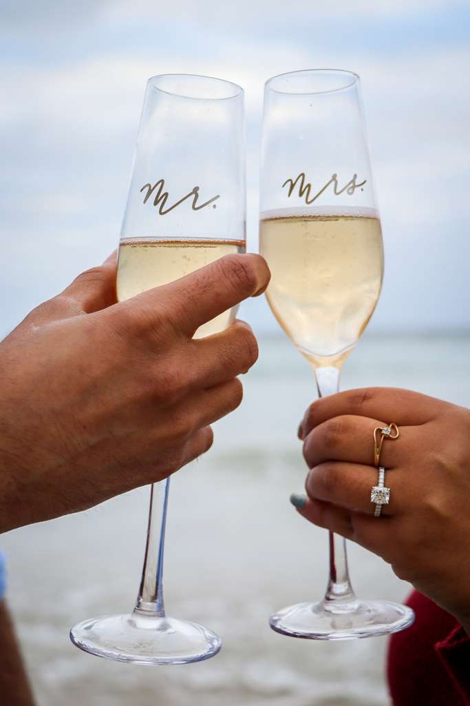 Fifth Alloy engagement ring shown during a champagne toast